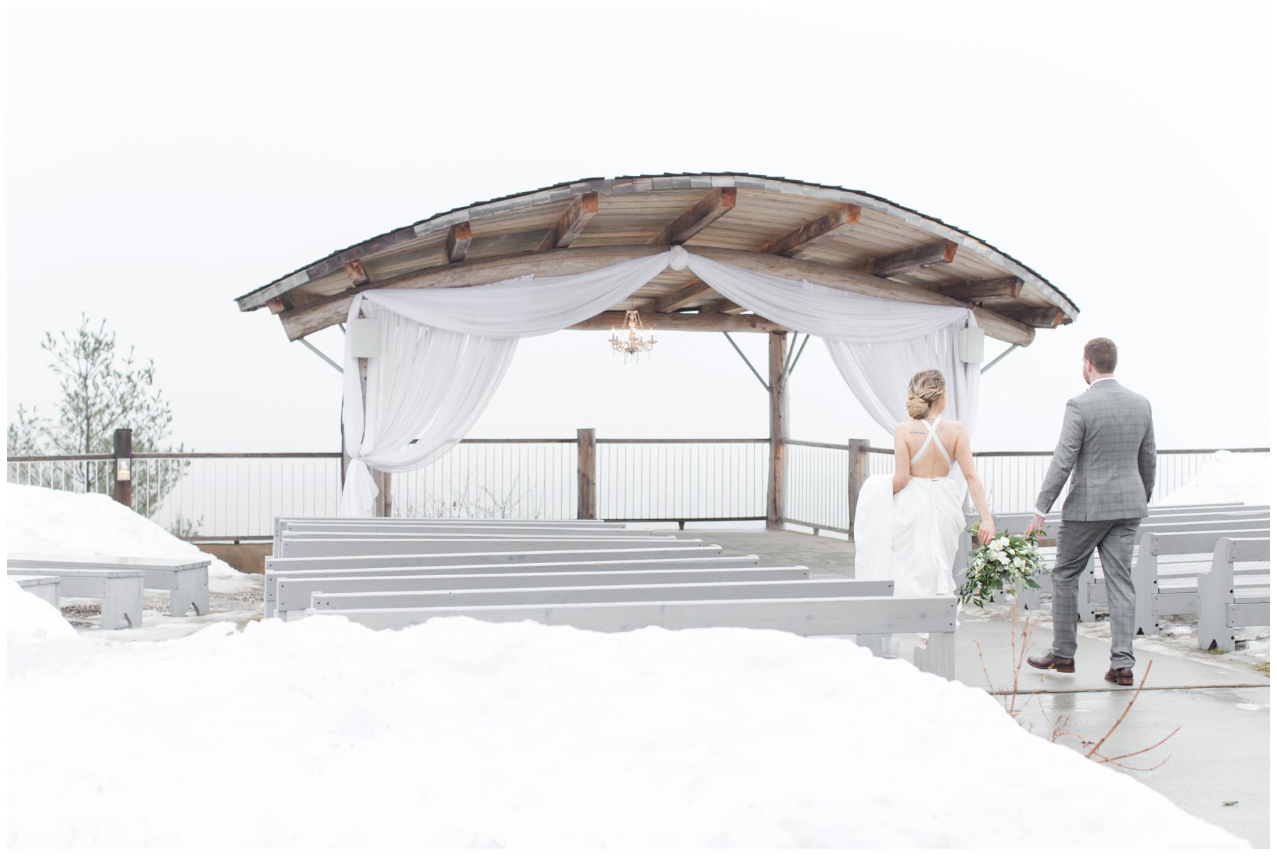 Le Belvedere Elopement Wakefield winter wedding bride and groom walking with snow