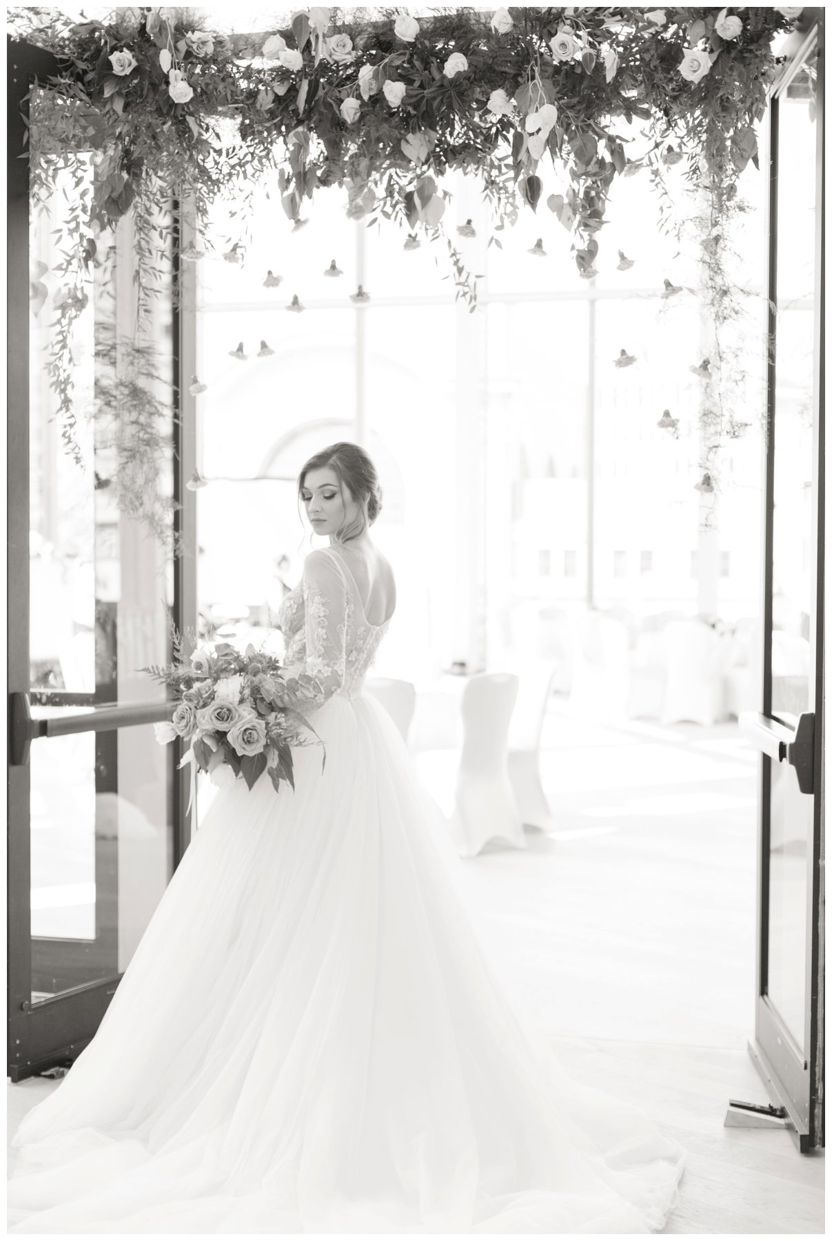 Fairytale wedding with lots of florals - Flower doorway arch by Capital Florist- Bride with white Nicole Spose’s dress from Sinders Bridal at Ottawa's NAC O'Born room wedding venue: The Barnett Company - Ottawa Wedding Photographer