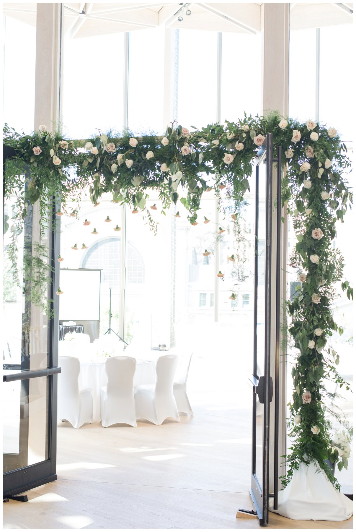 Fairytale wedding with lots of florals - Flower doorway arch at Ottawa's NAC O'Born room wedding venue: The Barnett Company - Ottawa Wedding Photographer