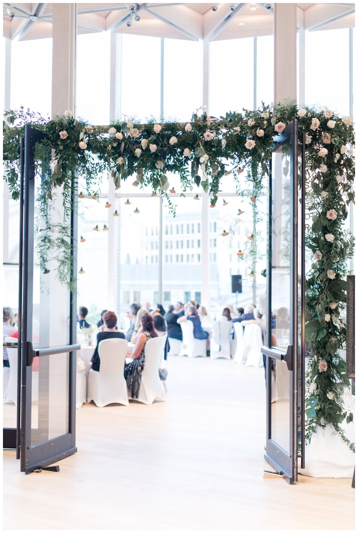 Fairytale wedding with lots of florals - Flower doorway arch at Ottawa's NAC O'Born room wedding venue: The Barnett Company - Ottawa Wedding Photographer