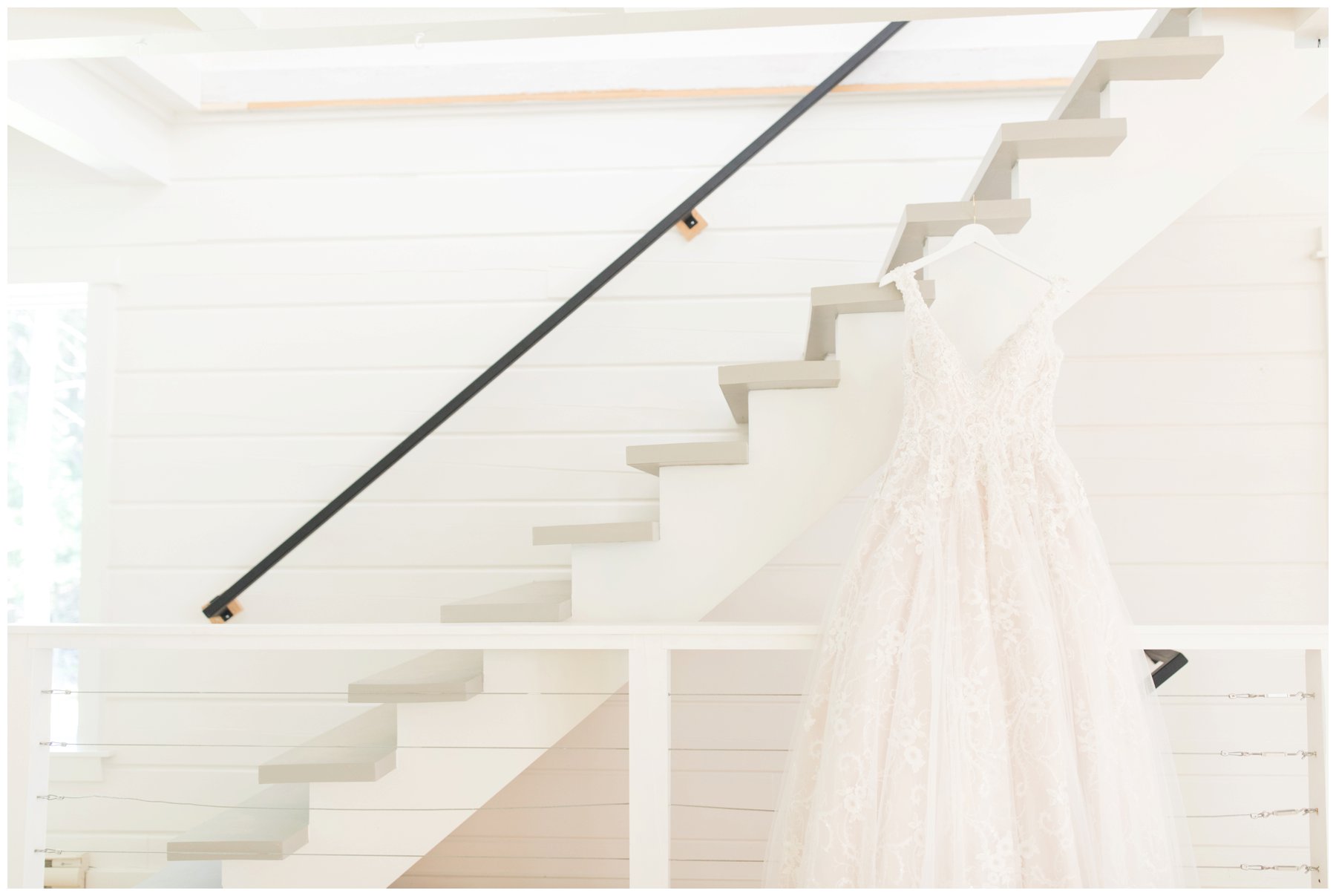 White dress on white staircase in the garden house at Le Belvedere