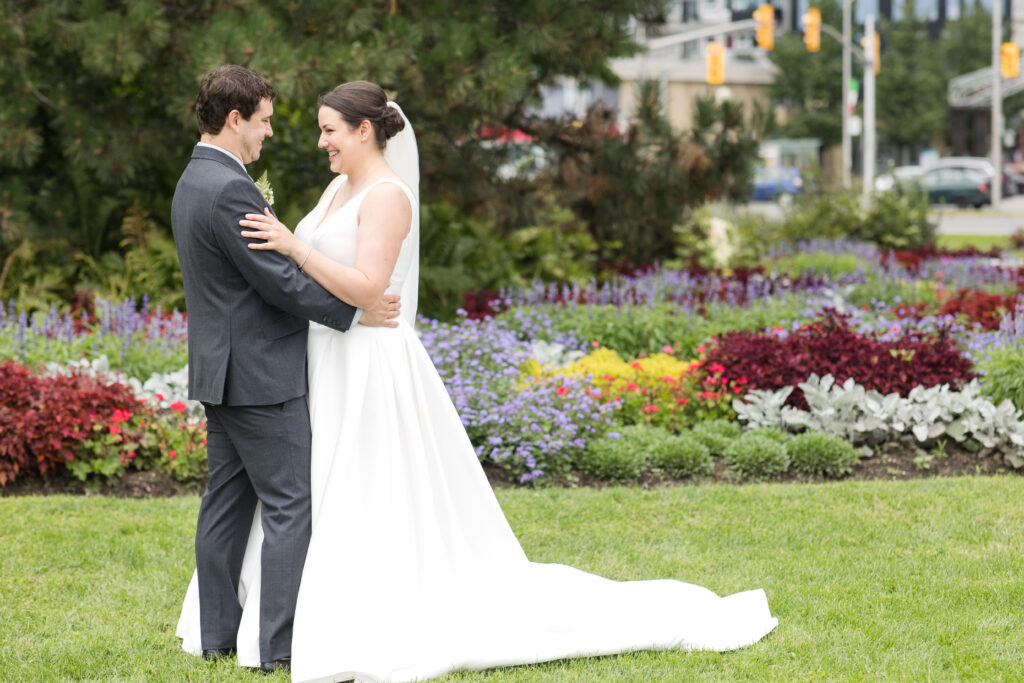 Bride and groom portraits in front of flowers